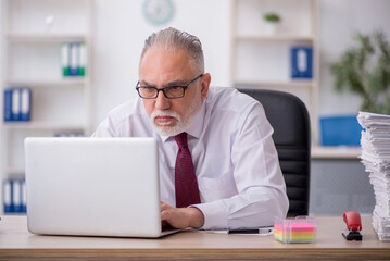 Old male employee and too much work in the office