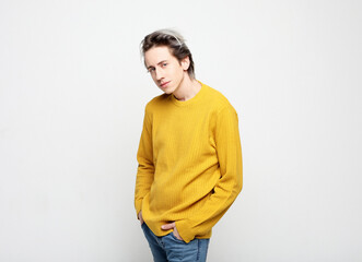 Portrait of a smart young man wearing casual standing against white background