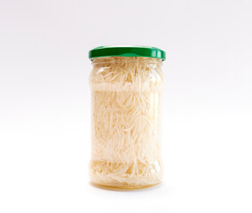 Real Isolated Celery Root Salad Preserve In Glass Jar With Screw Metal Cap On White Background. Shredded And Pickled Celery Crops, Tuber. Apium Graveolens, Culinary. Horizontal Plane