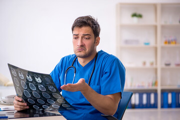 Young male doctor radiologist working in the clinic