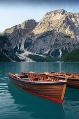 Stunning romantic place with typical wooden boats on the alpine lake,(Lago di Braies) Braies...