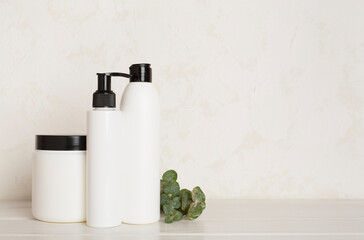 Professional hair care products with comb on wooden background