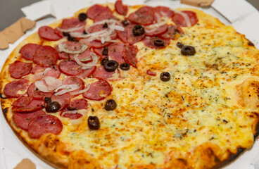 Traditional Italian pizza with long-matured dough. Pepperoni, marguerite, half four cheeses. 
