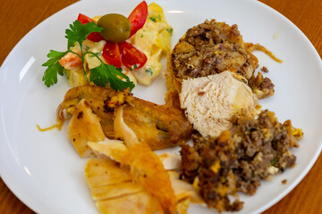 Traditional homemade mayonnaise salad with roasted chicken stuffed with Brazil-style farofa