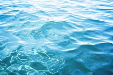 Rippling water texture background, gentle water waves and reflections, tranquil blue and green surface, soothing and calming