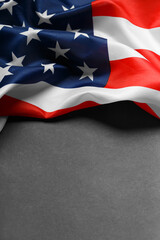 American flag on a black background, copy space. Symbol of independence, patriotism.