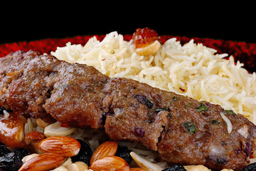 Oriental pilaf with lula kebab and nuts in honey