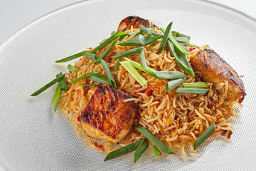 Pilaf with salmon on a white plate