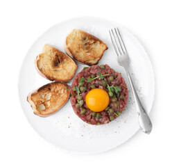 Tasty beef steak tartare served with yolk, capers, toasted bread and greens isolated on white, top...