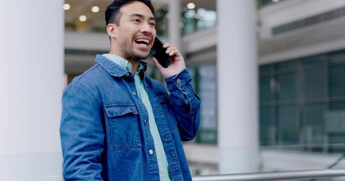 Phone call, talking and a man in a building for communication, chat and conversation with connection. Happy asian male person with a smartphone for negotiation, contact and creative work proposal