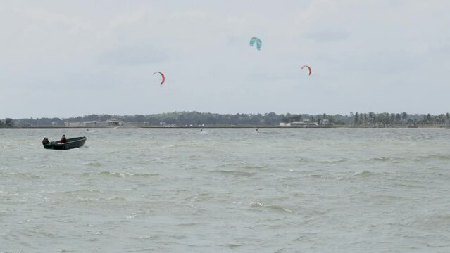 An Adventure Water sport activity where Parachutes are being used in Wind surfing in the Cauvery river in India.
