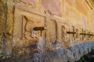 Closeup of 8 pipes fountain in Ronda, Andalusia, Spain