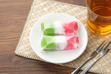 Kue Mendut or Kue Bugis, Indonesian traditional dessert made from glutinous rice flour, stuffed with sweet grated coconut. 
