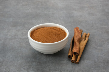 Kayu Manis Bubuk or Cinnamon Powder on bowl
