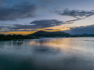 After the rain sunrise waterscape with clouds