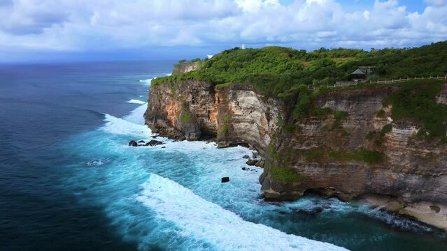 Waves Crashing On The Karang Boma Cliff - Uluwatu Cliff In Bali, Indonesia. - aerial