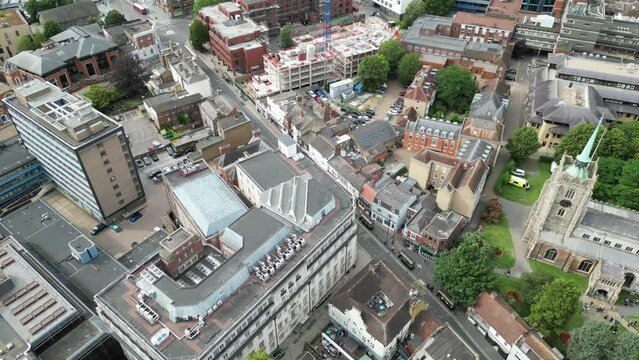 Pull back drone aerial reverse reveal Chelmsford cathedral and city centre