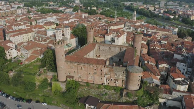 Aerial orbit shot over Ivrea Castle