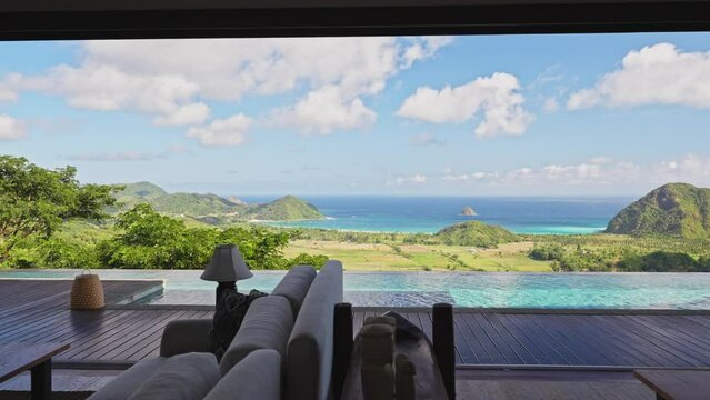 Large infinity pool next to entertaining area of private villa