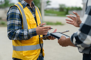 Engineer team discussing and working at outdoor construction site Inspect locations, paths,...