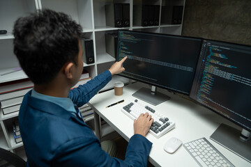 Fototapeta na wymiar IT programmer working on desktop computer Male expert innovating software engineer app development program check coding in bugging system.