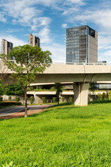 Concrete structure and asphalt road space under the overpass in the city