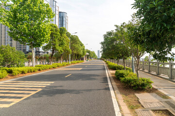 Empty urban road and buildings in the city - 630185457