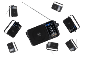 Radio receiver on a white background. Black portable wireless radio close-up isolated on a white background.