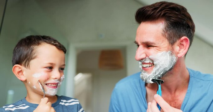 Funny, shaving and a father teaching his son about grooming or hygiene in the bathroom of their home together. Face, family and children with a boy learning how to shave with his single parent