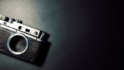 old film camera on a black background