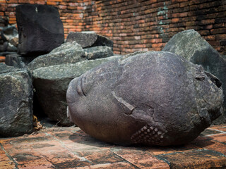 The head of the ancient Buddha piled up with the remains of the Buddha that has decayed over the past 500 years old.