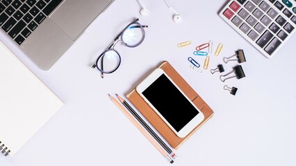 Top shot of an office table desk in flat lay. Working environment © Amit