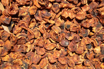 Dark dried apricots background. Healthy food