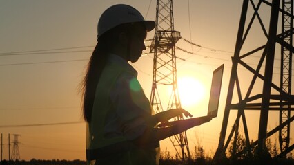 silhouette electrical engineer, work laptop sunset, electric tower, digital hand, engineer hardhat,...