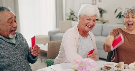 Playing cards, retirement and senior friends at a tea party together during a visit in a home for bonding. Community, fun and games with a group of elderly people in a house for a social gathering - Powered by Adobe