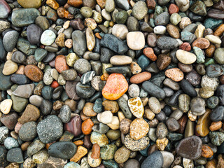 Beautiful wet colorful pebbles background.