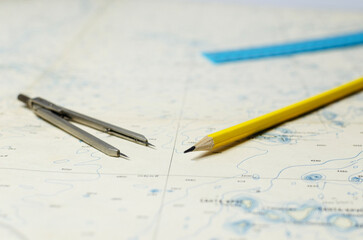 Dividers and pencil on the map