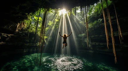Foto op Plexiglas A daring cliff diver leaping into a crystal-clear cenote, surrounded by lush greenery  © Наталья Евтехова