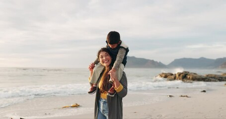 Beach, walking and mom with kid on shoulders happy together for outdoor holiday or vacation while bonding at sea. Love, care and parent or mother talking with child to enjoy quality time at ocean