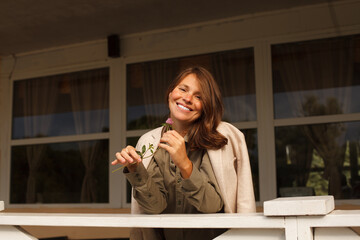 Cheerful woman resting, outdoors portrait