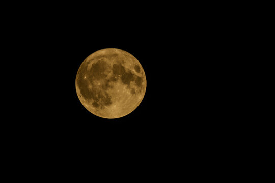 Delhi India 8 1 2023: Full moon in the night sky, closeup photo with selective focus 
