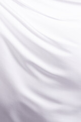 Fototapeta na wymiar Close up of white shiny silk fabric with copy space background