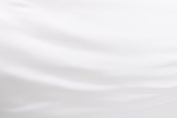 Obraz premium Close up of white shiny silk fabric with copy space background