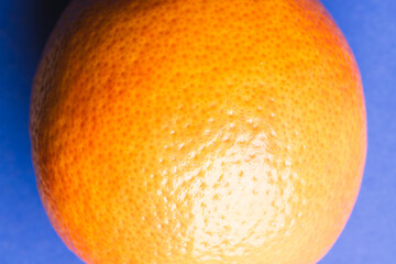 Close up of orange and copy space on blue background
