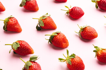 Close up of strawberries and copy space on pink background