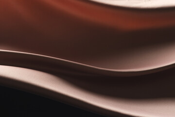 Fototapeta premium Close up of pink shiny silk fabric with copy space background