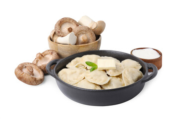 Serving pan with delicious dumplings (varenyky), fresh mushrooms and sour cream isolated on white