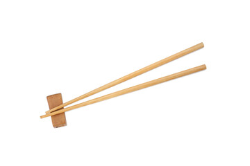 Pair of wooden chopsticks with rest isolated on white, top view