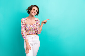 Photo of toothy beaming woman with short hairstyle wear colorful top indicating empty space sale...