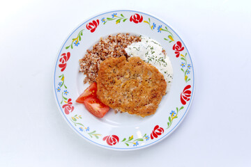 meat cutlet with buckwheat and sauce